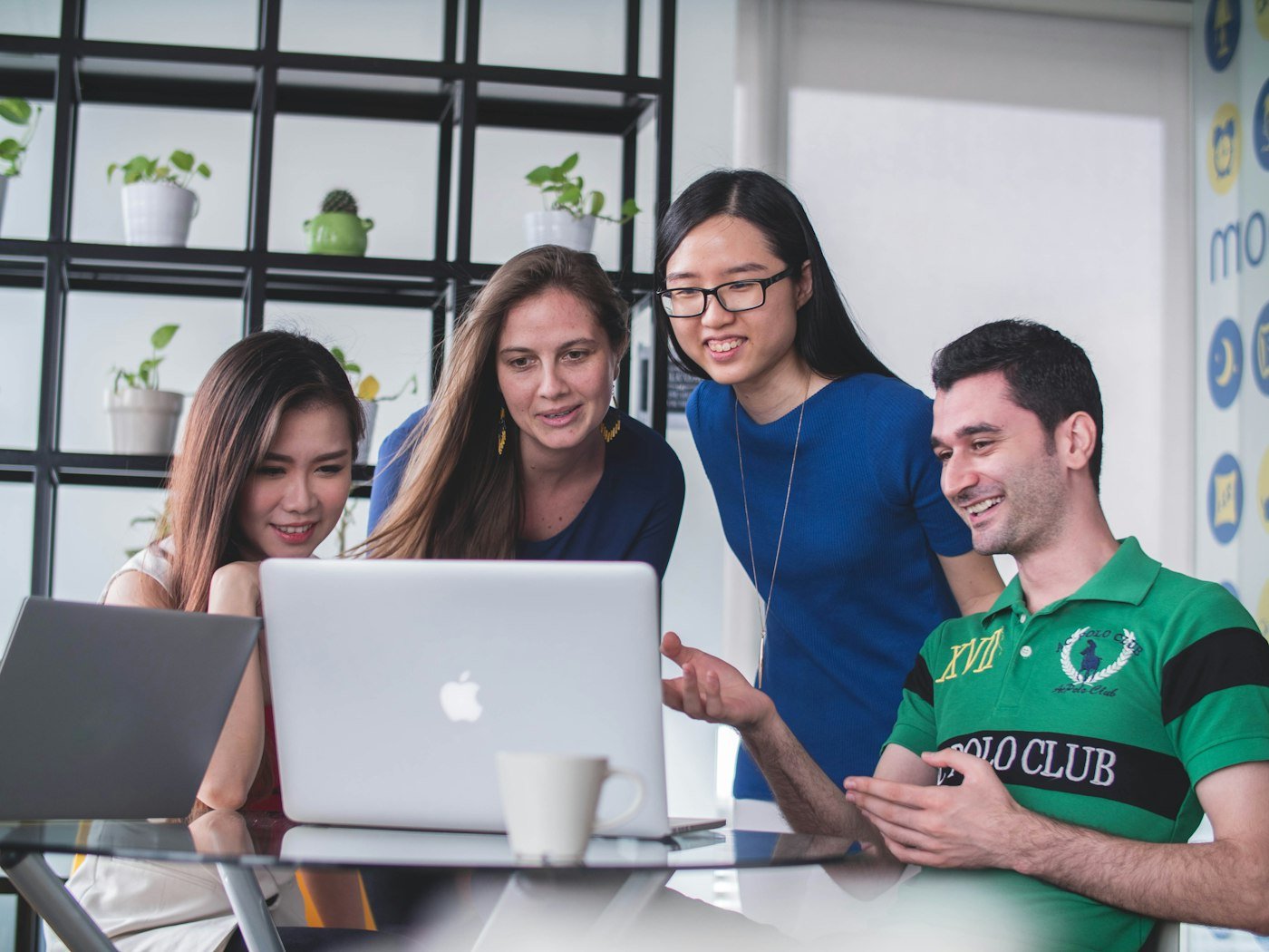 Marketing team reviewing results on a laptop